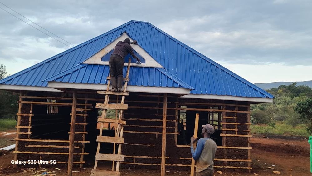 Blue iron-sheet roof with finished gable detail