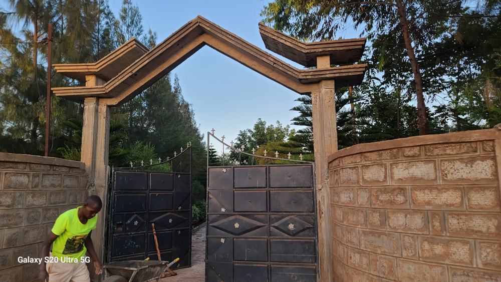 Concrete entrance arch with steel gate