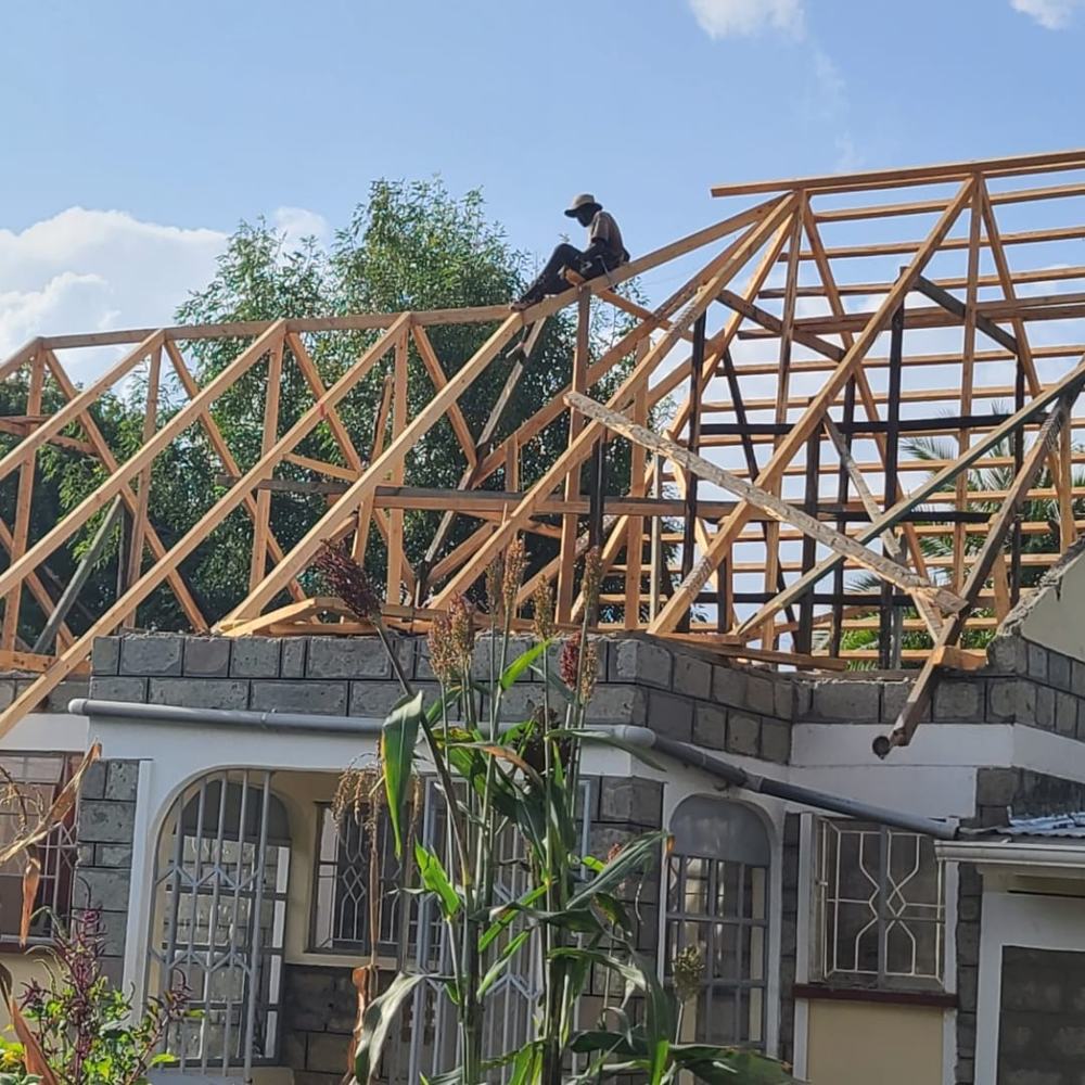 Timber roof trusses erected on a stone house